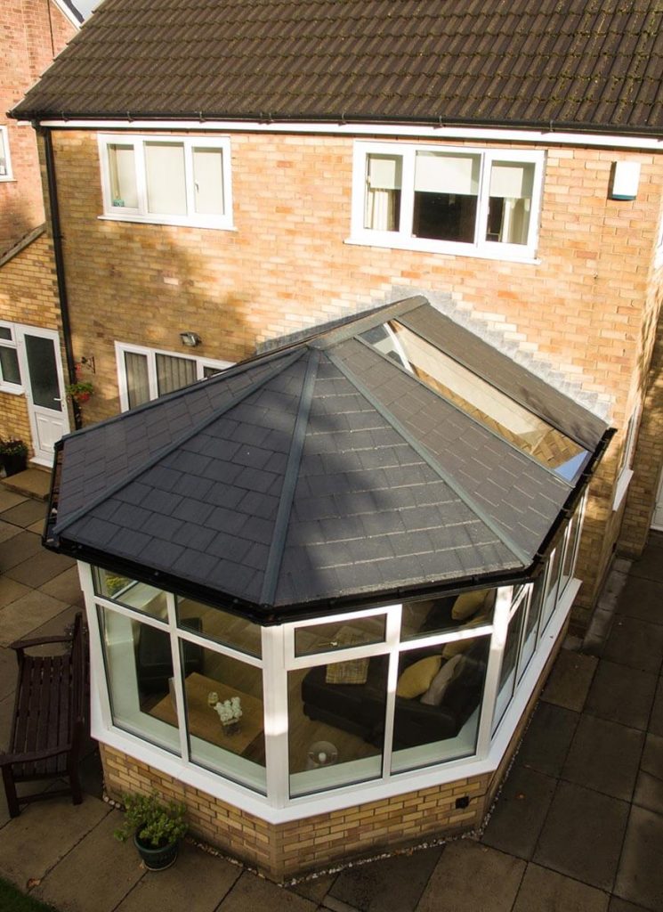 A conservatory installation with a tiled roof