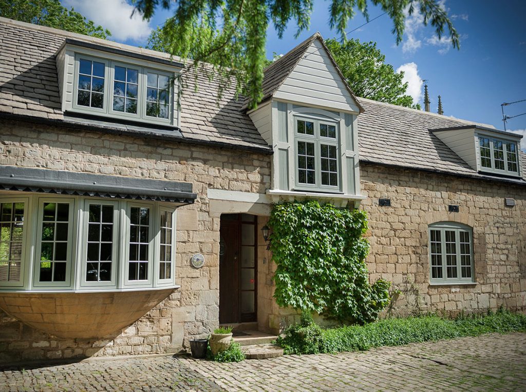 An installation of some bespoke uPVC windows for a traditional white stone property