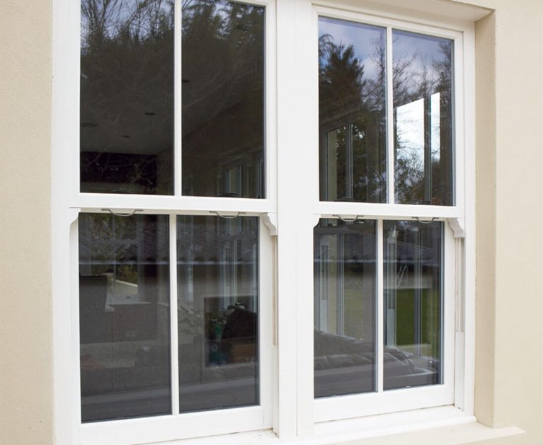 White UPVC vertical sliding window sash horns.