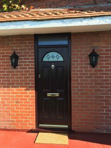 A rosewood composite entrance door