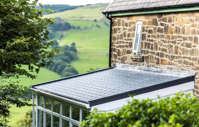 Lean to conservatory with a black tiled roof