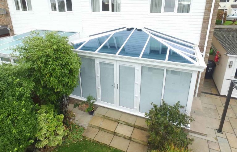 White uPVC Edwardian conservatory with a tinted glass roof