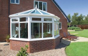 White uPVC Victorian conservatory with a glass roof
