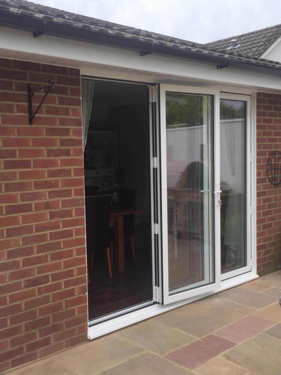 White aluminium bifold doors installation