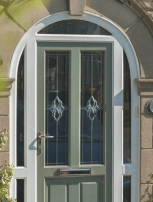 Green entrance door with white frame