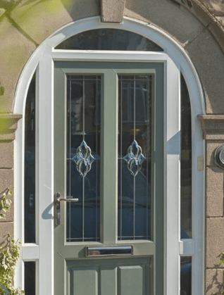 Green front door with arched white frame and decorative glass panels